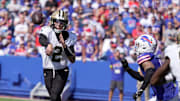 New Orleans quarterback Spencer Rattler tries to get off a pass as he spies Buffalo Bills Terrel Bernard coming for him during first half action of the Bills home game against the New Orleans Saints in Orchard Park on Sept. 28, 2025. The pass was incomplete.
