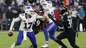 Sep 29, 2024; Baltimore, Maryland, USA; Buffalo Bills quarterback Josh Allen (17) scrambles from Baltimore Ravens safety Eddie Jackson (39) at M&T Bank Stadium. Mandatory Credit: Geoff Burke-Imagn Images