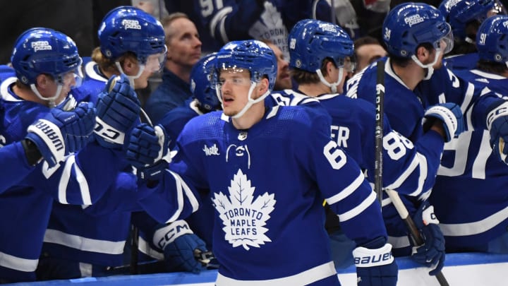 Apr 11, 2024; Toronto, Ontario, CAN; Toronto Maple Leafs forward David Kampf (64) celebrates with team mates at the bench after scoring a goal against the New Jersey Devils in the second period at Scotiabank Arena. Mandatory Credit: Dan Hamilton-USA TODAY Sports