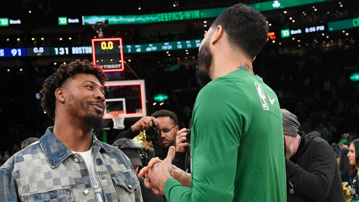 Feb 4, 2024; Boston, Massachusetts, USA; Memphis Grizzlies guard Marcus Smart (36)  talks to Boston Celtics forward Jayson Tatum (right) after a game at TD Garden. Mandatory Credit: Eric Canha-USA TODAY Sports