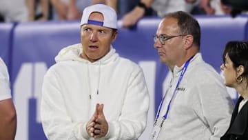 Sep 21, 2024; Provo, Utah, USA; Brigham Young Cougars alumni and Utah Jazz owner Ryan Smith speaks with Adrian Wojnarowski in the game against the Kansas State Wildcats at LaVell Edwards Stadium.