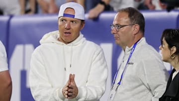Sep 21, 2024; Provo, Utah, USA; Brigham Young Cougars alumni and Utah Jazz owner Ryan Smith speaks with Adrian Wojnarowski in the game against the Kansas State Wildcats at LaVell Edwards Stadium.