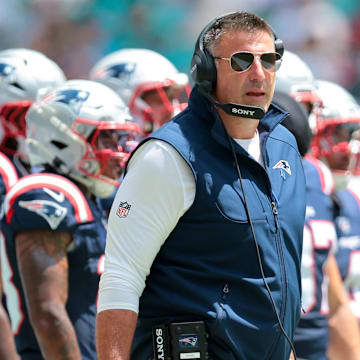 Sep 14, 2025; Miami Gardens, Florida, USA; New England Patriots head coach Mike Vrabel watches from the sideline against the Miami Dolphins during the first quarter at Hard Rock Stadium. Mandatory Credit: Sam Navarro-Imagn Images