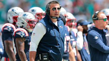Sep 14, 2025; Miami Gardens, Florida, USA; New England Patriots head coach Mike Vrabel watches from the sideline against the Miami Dolphins during the first quarter at Hard Rock Stadium. Mandatory Credit: Sam Navarro-Imagn Images