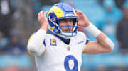 Nov 30, 2025; Charlotte, North Carolina, USA; Los Angeles Rams quarterback Matthew Stafford (9) calls a play during the fourth quarter against the Carolina Panthers at Bank of America Stadium. Mandatory Credit: Scott Kinser-Imagn Images