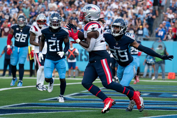 New England Patriots running back Rhamondre Stevenson (38) hauls in a touchdown pass from New England Patriots quarterback Dr