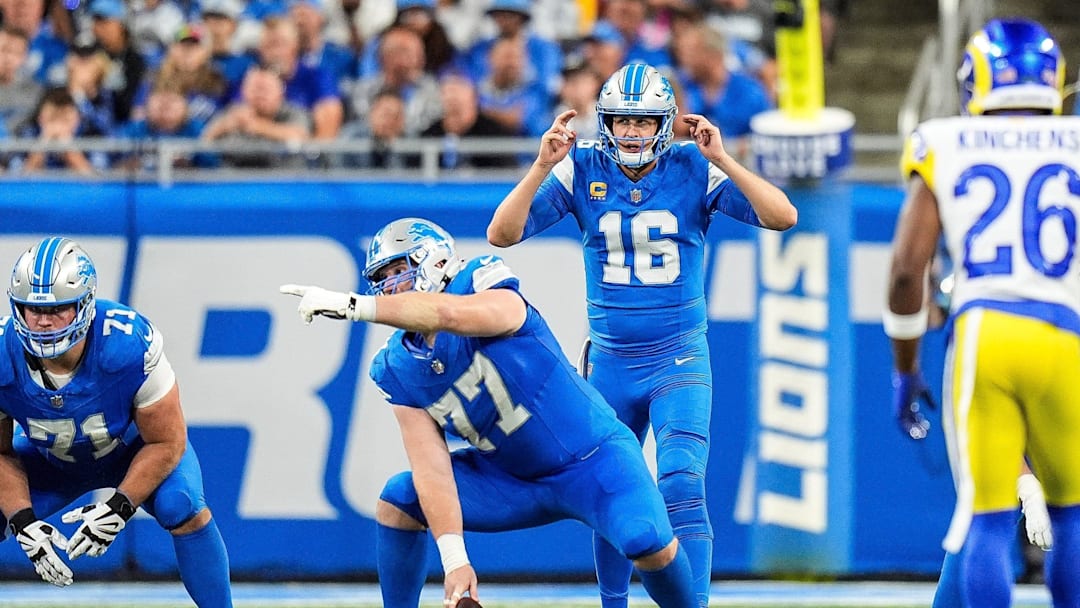 Detroit Lions quarterback Jared Goff (16) talks to center Frank Ragnow (77) before a snap against Los Angeles Rams during the second half at Ford Field in Detroit on Sunday, September 8, 2024.
