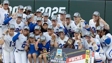 Florida gator pose for photos as they celebrate their 5-2 win over Georgia during the third game of the NCAA super regionals softball game in Gainesville, FL on Sunday, May 25, 2025. Florida goes to the college world series in Oklahoma. [Alan Youngblood/Gainesville Sun]