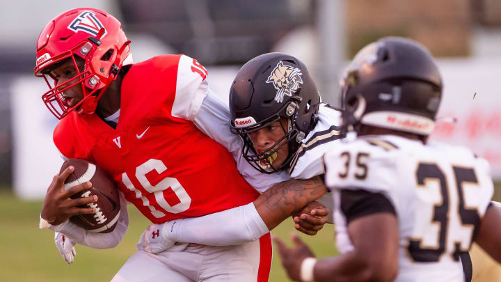 Buchholz Bobcats defensive end Evan Walker (15) takes down Vanguard Knights Matthew Dial (16) in the first half. The Vanguard Knights hosted the Buchholz Bobcats at Booster Stadium in Ocala, FL on Friday, August 23, 2024. Buchholz lead at the half 17-7. [Doug Engle/Ocala Star Banner]