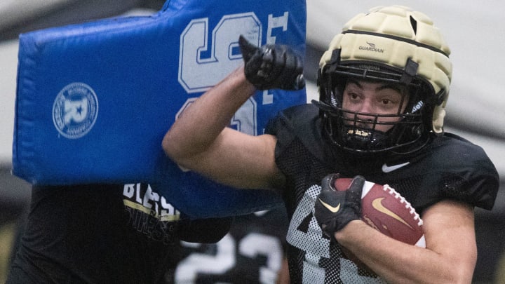 Purdue Boilermakers running back Devin Mockobee (45) runs a drill 