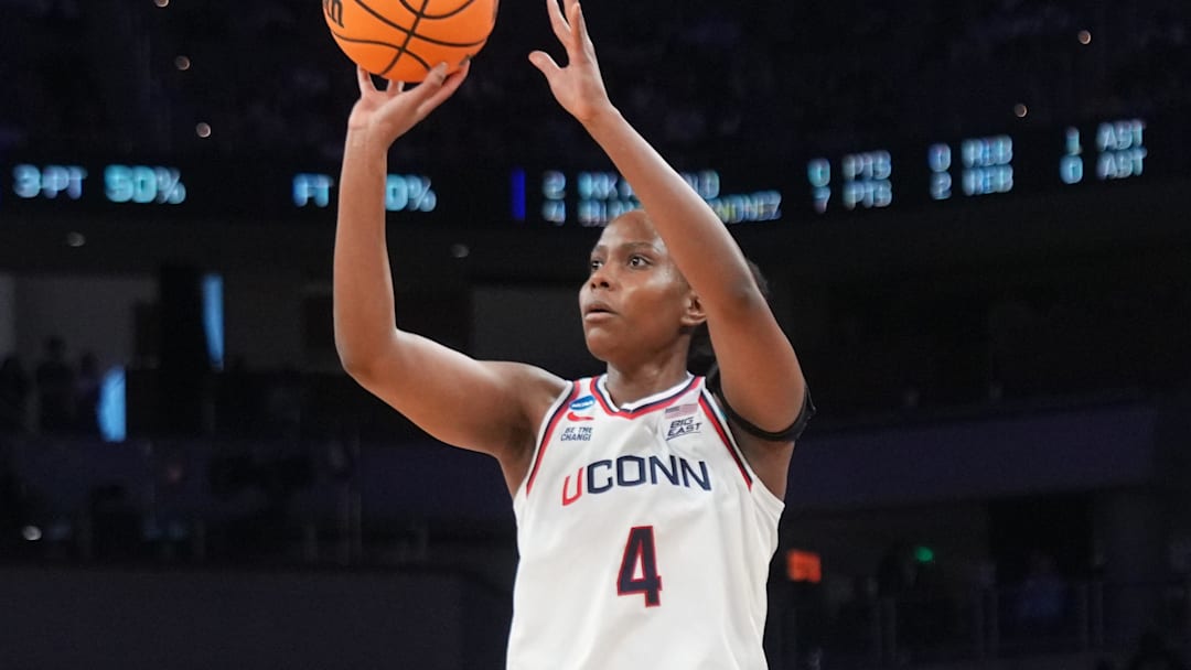 Mar 29, 2026; Fort Worth, TX, USA; UConn Huskies guard Blanca Quinonez (4) scores a basket against the Notre Dame Fighting Irish during the first half at Dickies Arena. Mandatory Credit: Chris Jones-Imagn Images