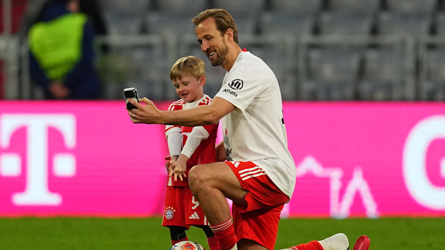 Harry Kane taking a selfie with his son.