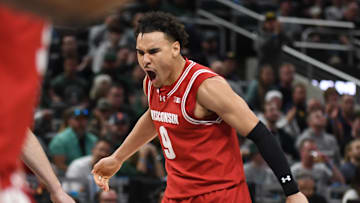 Mar 15, 2025; Indianapolis, IN, USA; Wisconsin Badgers guard John Tonje (9) celebrates after a play during the second half against the Michigan State Spartans at Gainbridge Fieldhouse. Mandatory Credit: Robert Goddin-Imagn Images