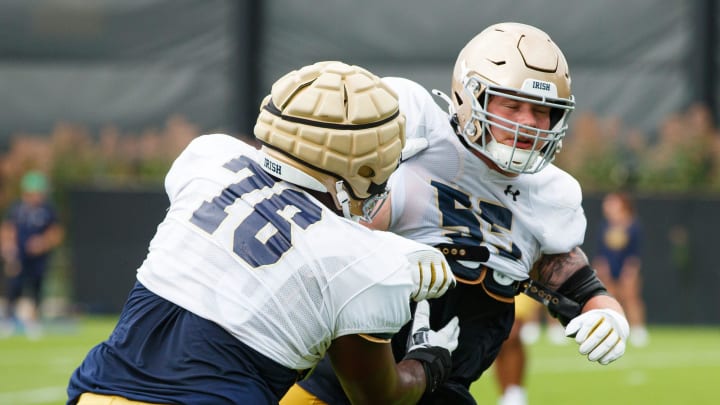 Notre Dame offensive linemen Guerby Lambert (76) and Chris Terek participate in a drill during a Notre Dame football practice at Irish Athletic Center on Tuesday, Aug. 6, 2024, in South Bend.