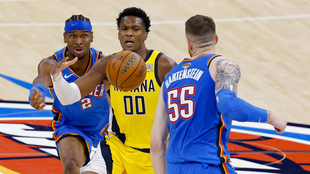 Jun 8, 2025; Oklahoma City, Oklahoma, USA; Oklahoma City Thunder guard Shai Gilgeous-Alexander (2) and center Isaiah Hartenstein (55) and Indiana Pacers guard Bennedict Mathurin (00) battle for the loose ball during the third quarter of game two of the 2025 NBA Finals at Paycom Center. Mandatory Credit: Alonzo Adams-Imagn Images
