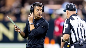Sep 8, 2024; New Orleans, Louisiana, USA;  Carolina Panthers head coach Dave Canales talks to down judge Derick Bowers (74) on a time out against the New Orleans Saints during the first half at Caesars Superdome. Mandatory Credit: Stephen Lew-Imagn Images