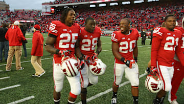 Oct 6, 2012; Madison, WI, USA; Wisconsin Badgers running backs Melvin Gordon (25), Montee Ball (28) and James White (20) walk off the field against the Illinois Fighting Illini at Camp Randall Stadium. The Badgers defeated the Fighting Illini 31-14. Mandatory Credit: Brace Hemmelgarn-Imagn Images