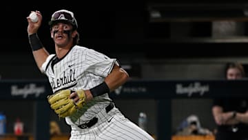 Vanderbilt third baseman Brodie Johnston (9) tries to throw out Louisville's Alex Alicea during the ninth inning of the Nashville Regional NCAA Baseball Tournament game at Hawkins Field Saturday, May 31, 2025, in Nashville, Tenn.