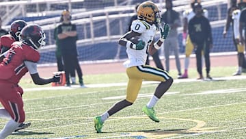Taft wide receiver Lorenzo McMullen runs the ball during the Senators' win over Hughes Saturday, Oct. 5, 2024.