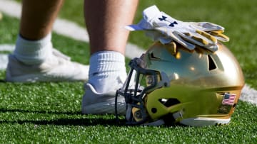 Notre Dame football players warm up before facing Oregon State at the Sun Bowl