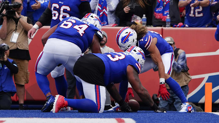 Nov 3, 2024; Orchard Park, New York, USA; Buffalo Bills wide receiver Mack Hollins (13) celebrates scoring a touchdown with Buffalo Bills offensive tackle Dion Dawkins (73) and Buffalo Bills guard O'Cyrus Torrence (64) during the second half against the Miami Dolphins at Highmark Stadium.