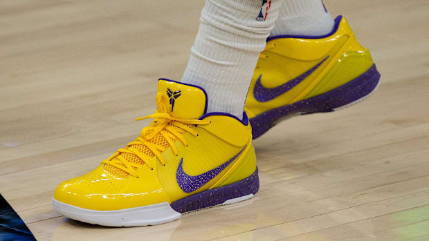 Anthony Davis's gold and purple Nike sneakers.