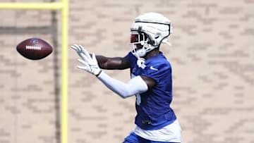Kaiir Elam pulls in a throw as he works on individual drills.