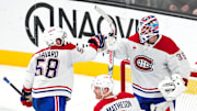 Dec 31, 2024; Las Vegas, Nevada, USA; Montreal Canadiens defenseman David Savard (58) congratulates goaltender Sam Montembeault (35) after the Canadiens defeated the Vegas Golden Knights 3-2 at T-Mobile Arena. Mandatory Credit: Stephen R. Sylvanie-Imagn Images