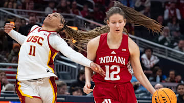 Indiana Hoosiers guard Yarden Garzon (12) uses a screen Friday, March 7, 2025, against USC Trojans guard Kennedy Smith (11) during the Big Ten women's tournament at Gainbridge Fieldhouse in Indianapolis.