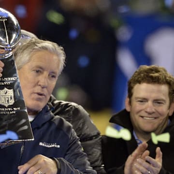 Feb 2, 2014; East Rutherford, NJ, USA; Seattle Seahawks head coach Pete Carroll (left) holds the Vince Lombardi Trophy after Super Bowl XLVIII against the Denver Broncos  at MetLife Stadium.  Mandatory Credit: Kirby Lee-Imagn Images