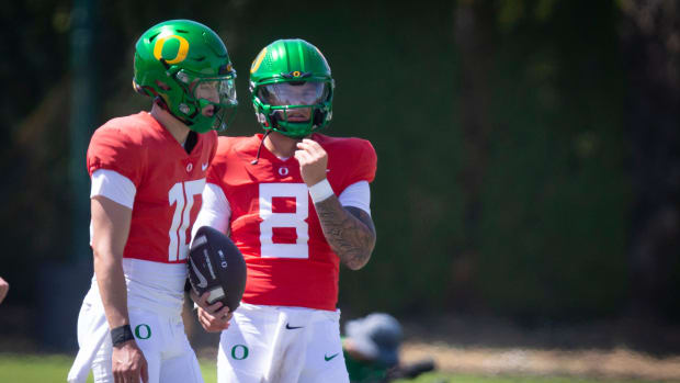 Oregon quarterbacks Luke Moga, left, and Dillon Gabriel during the Ducks’ fall camp Tuesday, Aug. 6, 2024, at the Hatfield-Do