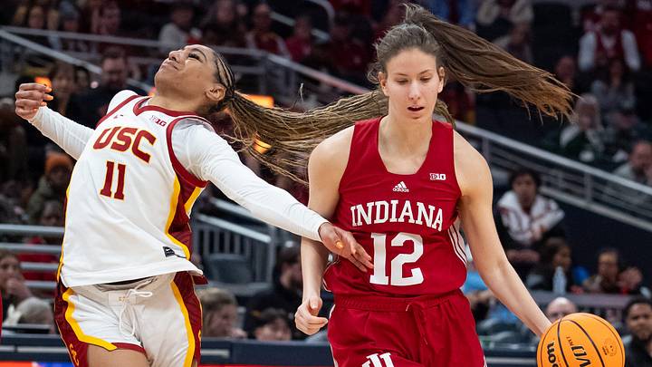 Indiana Hoosiers guard Yarden Garzon (12) uses a screen Friday, March 7, 2025, against USC Trojans guard Kennedy Smith (11) during the Big Ten women's tournament at Gainbridge Fieldhouse in Indianapolis.