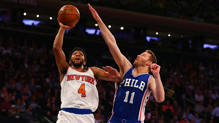 Apr 12, 2017; New York, NY, USA; New York Knicks guard Chasson Randle (4) takes a shot while being defended by Philadelphia 76ers guard Nik Stauskas (11) during the second half at Madison Square Garden. The Knicks won 114-113. Mandatory Credit: Andy Marlin-Imagn Images