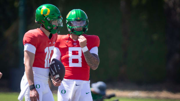 Oregon quarterbacks Luke Moga, left, and Dillon Gabriel during the Ducks’ fall camp