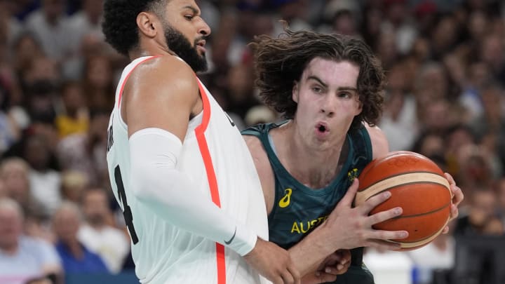 Jul 30, 2024; Villeneuve-d'Ascq, France; Australia guard Josh Giddey (3) drives against Canada guard Jamal Murray (4) in a men's group stage basketball match during the Paris 2024 Olympic Summer Games at Stade Pierre-Mauroy. Mandatory Credit: John David Mercer-USA TODAY Sports