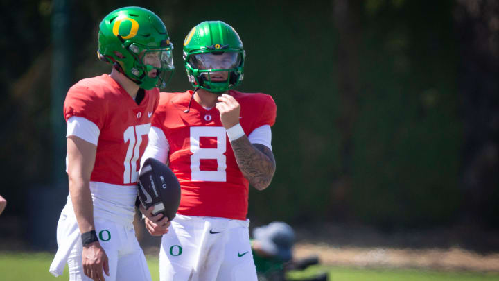 Oregon quarterbacks Luke Moga, left, and Dillon Gabriel during the Ducks’ fall camp Tuesday, Aug. 6, 2024, at the Hatfield-Dowlin Complex in Eugene, Ore.