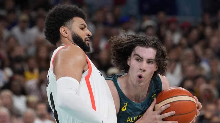 Jul 30, 2024; Villeneuve-d'Ascq, France; Australia guard Josh Giddey (3) drives against Canada guard Jamal Murray (4) in a men's group stage basketball match during the Paris 2024 Olympic Summer Games at Stade Pierre-Mauroy. Mandatory Credit: John David Mercer-USA TODAY Sports