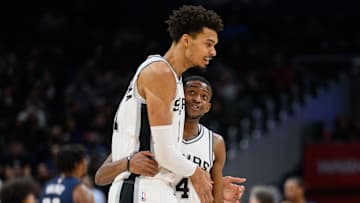 Feb 10, 2025; Washington, District of Columbia, USA; San Antonio Spurs center Victor Wembanyama (1) and guard De'Aaron Fox (4) react during the second quarter against the Washington Wizards at Capital One Arena. Mandatory Credit: Reggie Hildred-Imagn Images