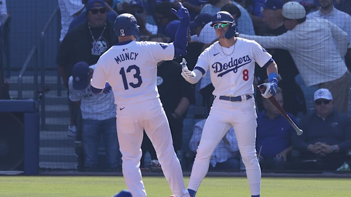Oct 14, 2024; Los Angeles, California, USA; Los Angeles Dodgers third base Max Muncy (13) reacts after hitting a home run with third base Enrique Hernández (8) against the New York Mets in the fifth inning during game two of the NLCS for the 2024 MLB Playoffs at Dodger Stadium. Mandatory Credit: Jason Parkhurst-Imagn Images Oct 14, 2024; Los Angeles, California, USA; Los Angeles Dodgers third base Max Muncy (13) reacts after hitting a home run with third base Enrique Hernández (8) against the New York Mets in the fifth inning during game two of the NLCS for the 2024 MLB Playoffs at Dodger Stadium. Mandatory Credit: Jason Parkhurst-Imagn Images