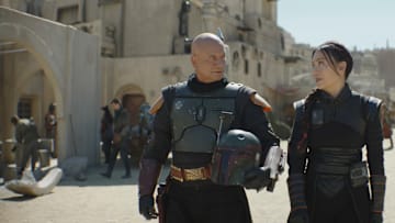 (L-R): Boba Fett (Temuera Morrison) and Fennec Shand (Ming-Na Wen) in Lucasfilm's THE BOOK OF BOBA FETT, exclusively on Disney+. © 2022 Lucasfilm Ltd. & ™. All Rights Reserved.