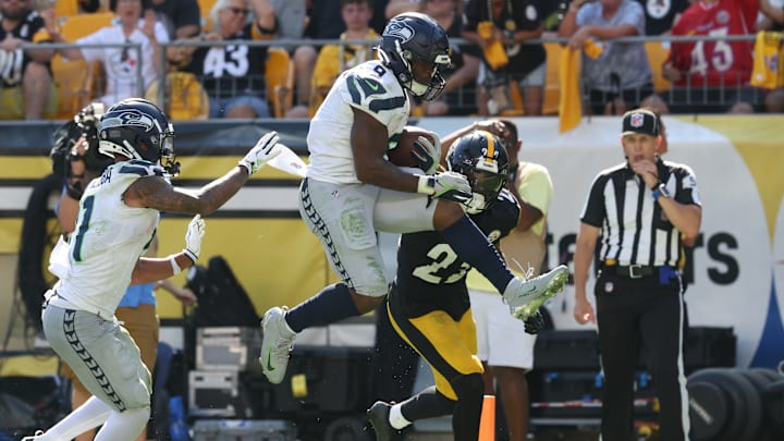 Sep 14, 2025; Pittsburgh, Pennsylvania, USA; Seattle Seahawks running back Kenneth Walker III (9) leaps into the end-zone to score a touchdown against the Pittsburgh Steelers during the fourth quarter at Acrisure Stadium. 