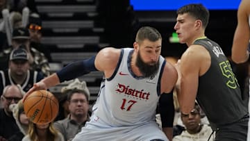 Feb 1, 2025; Minneapolis, Minnesota, USA; Washington Wizards center Jonas Valanciunas (17) works against Minnesota Timberwolves forward Luka Garza (55) in the third quarter at Target Center. Mandatory Credit: Bruce Kluckhohn-Imagn Images