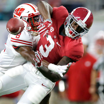 Wisconsin Badgers cornerback Sojourn Shelton (8) breaks up a long pass intended for Alabama Crimson Tide wide receiver Calvin Ridley (3) during the football season opener between Wisconsin and Alabama in 2015 in Arlington, Texas.  The Badgers and Crimson Tide will meet again in 2024 and 2025.Uwgrid06 08of X Spt Wooddf