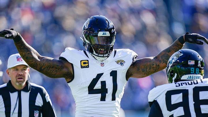 Jacksonville Jaguars defensive end Dawuane Smoot (98) and defensive end Josh Hines-Allen (41) celebrate sacking Tennessee Titans quarterback Cam Ward (1) during the second quarter at Nissan Stadium in Nashville, Tenn., Sunday, Nov. 30, 2025.