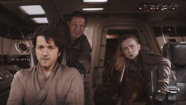 (L-R): Cassian Andor (Diego Luna), Arvel Skeen (Ebon Moss-Bachrach), Karis Nemik (Alex Lawther, seated) and Vel Sartha (Faye Marsay) in Lucasfilm's ANDOR, exclusively on Disney+. ©2022 Lucasfilm Ltd. & TM. All Rights Reserved.