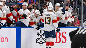 Oct 26, 2024; Elmont, New York, USA;  Florida Panthers center Sam Reinhart (13) celebrates his goal with the Florida Panthers bench against the New York Islanders during the first period at UBS Arena. 