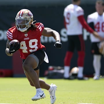 Jun 11, 2025; Santa Clara, CA, USA; San Francisco 49ers running back Corey Kiner (49) runs a play from scrimmage during a team OTA at Levi's Stadium. Mandatory Credit: D. Ross Cameron-Imagn Images