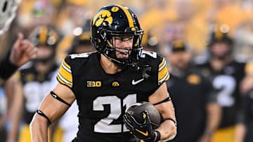 Sep 13, 2025; Iowa City, Iowa, USA; Iowa Hawkeyes wide receiver Kaden Wetjen (21) runs for a touchdown during the first quarter against the Massachusetts Minutemen at Kinnick Stadium. Mandatory Credit: Jeffrey Becker-Imagn Images