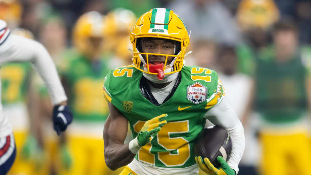 Oregon Ducks wide receiver Tez Johnson (15) against the Liberty Flames during the 2024 Fiesta Bowl at State Farm Stadium.