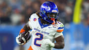 Dec 31, 2024; Glendale, AZ, USA; Boise State Broncos running back Ashton Jeanty (2) rushes the ball against the Penn State Nittany Lions during the first half in the Fiesta Bowl at State Farm Stadium. Mandatory Credit: Mark J. Rebilas-Imagn Images